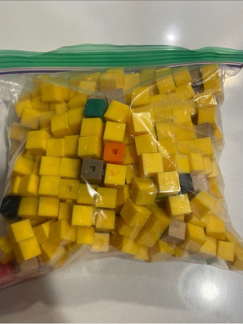 Bag of Yellow Wooden and Plastic Cubes with Assorted Accent Colors